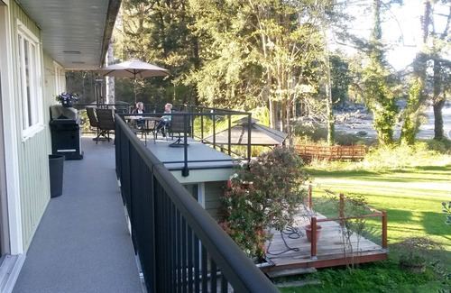 Heriot Bay House | Spectacular beach front property with stunning view of coastal mountains. n