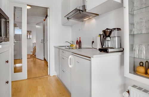 Akirkeby Apartment | Spend a relaxing vacation in this cozy apartment with shared pool.