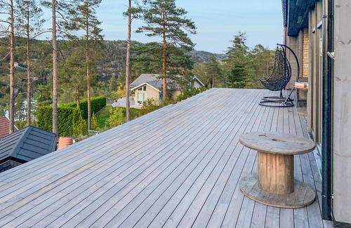 Kragero House | Spend an idyllic island vacation in this enchanting vacation home by the fjord.