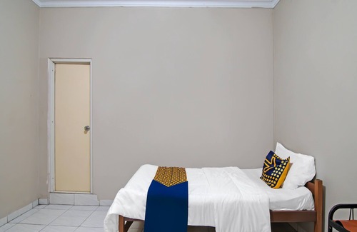 Pekanbaru Hotel | SPOT ON 91958 Flamboyan 25 Homestay Syariah