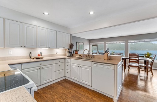 Olympia House | Sprawling lakefront property with kayaks, large deck, game table, & fireplace