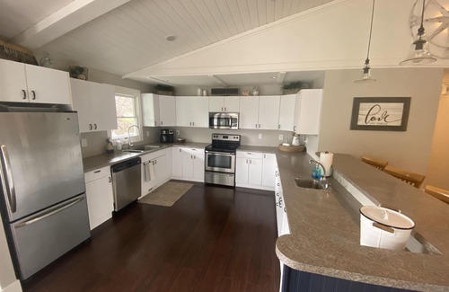 Ferrysburg House | Spring Lake waterfront home on Markers Cove with full Spring Lake access!