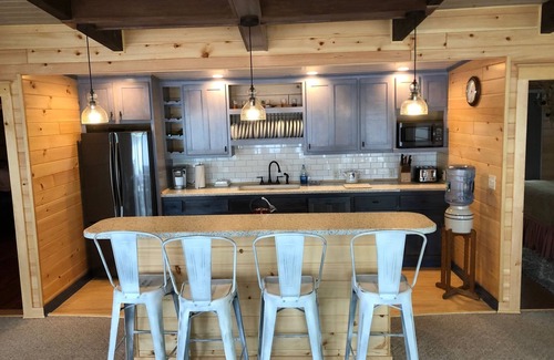 Hammond House | St. Lawrence River Cottage with 107 ft of river frontage and a boathouse