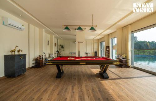 Taoru Villa | StayVista at Aarna Estate with library, lawn