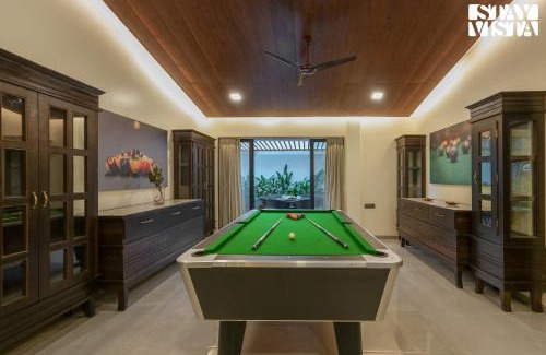 Kune Village Villa | StayVista's Casa Ember - Relax with a Pool Table, Gazebo, and Inviting Swimming Pool