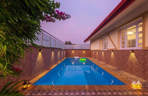 Kune Village Villa | StayVista's V Square - Enjoy a pool and indoor games for a leisurely stay