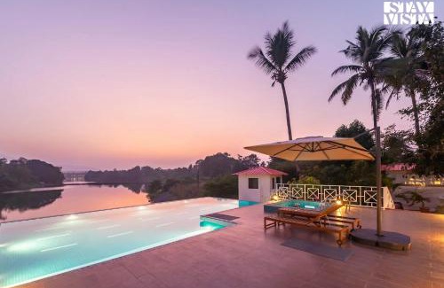 Vada Villa | StayVista's Waterway Retreat - Lakeside Oasis with Infinity Pool