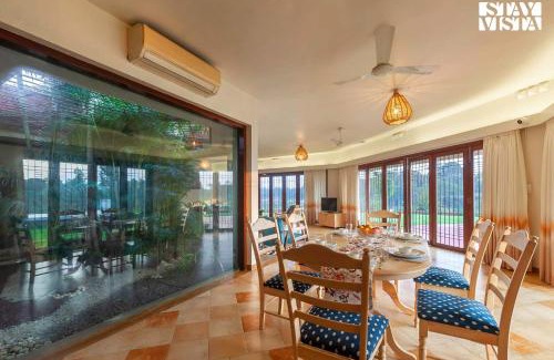Vada Villa | StayVista's Waterway Retreat - Lakeside Oasis with Infinity Pool
