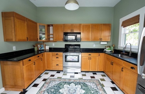 Seminole Heights House | Step into Tampa charm at this sun-drenched 1913 bungalow in Seminole Heights! Walk to top-rated cafes, breweries, and bakeries, then unwind in a beautifully renovated space filled with character, comfort, and local flair. Historic soul, modern style.
