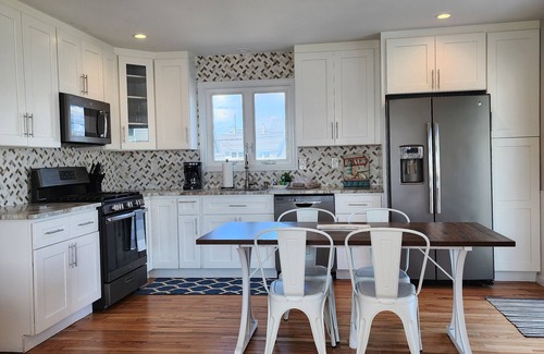 Fairfield House | Steps from the beach with water views!