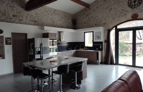Fontanes House | Stone house renovated in a contemporary style with garden and swimming pool.