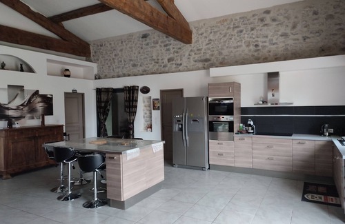 Fontanes House | Stone house renovated in a contemporary style with garden and swimming pool.