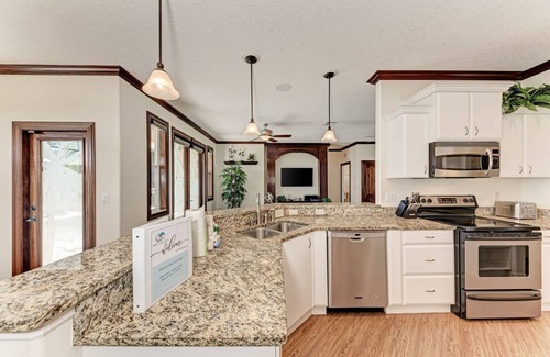 Palma Sola House | Stuck on 'Cation: Pool, Spa, Outdoor Kitchen, Screened Lanai by Anna Maria Life Vacation Rentals