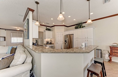 Palma Sola House | Stuck on 'Cation: Pool, Spa, Outdoor Kitchen, Screened Lanai by Anna Maria Life Vacation Rentals