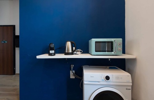 San Donato - Campidoglio Apartment | Studio apartment with double bed, armchair bed and equipped kitchenette.