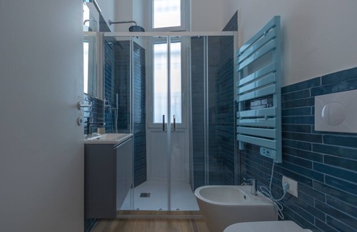 San Donato - Campidoglio Apartment | Studio apartment with double bed, armchair bed and equipped kitchenette.