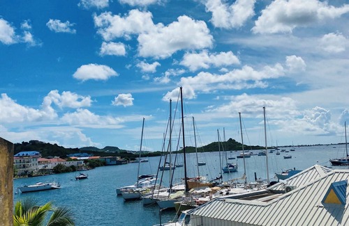 Marigot Apartment | Studio Cocoon, sea and marina view.