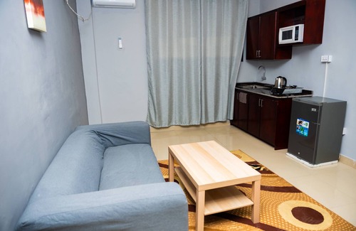 Margibi County Apartment | Studio suite with Two Queen Bed, Sofa and kitchen