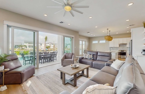 Rockport House | Stunning canal front home with private pool, fire pit, and boat dock