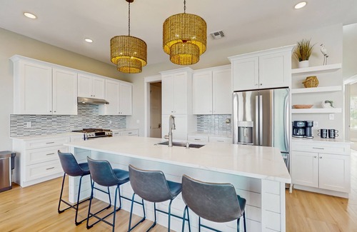 Rockport House | Stunning canal front home with private pool, fire pit, and boat dock