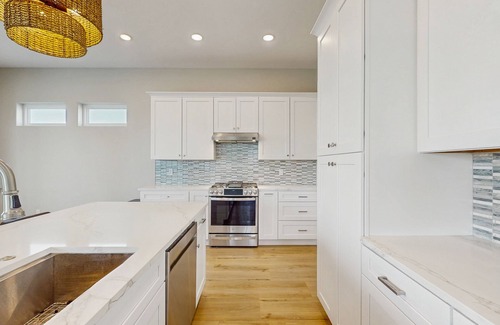 Rockport House | Stunning canal front home with private pool, fire pit, and boat dock