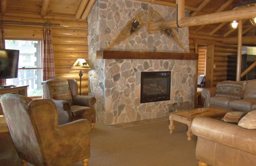 Walker Resort | Stunning Log Home on the water's edge with deck overlooking the swimming pool.