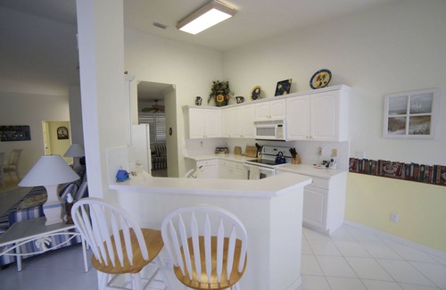 Biggar Condo | Stunning vaulted ceilings, lakeside location