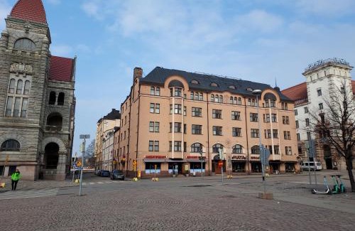 Kluuvi Apartment | Stylish home with stunning views of the railway square 74m2
