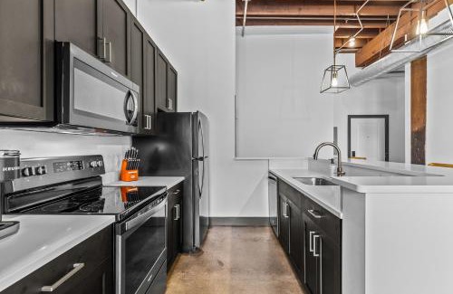 Downtown St. Louis Apartment | Stylish Riverfront Loft- Gym - Walk to Arch, Casino, Conventions