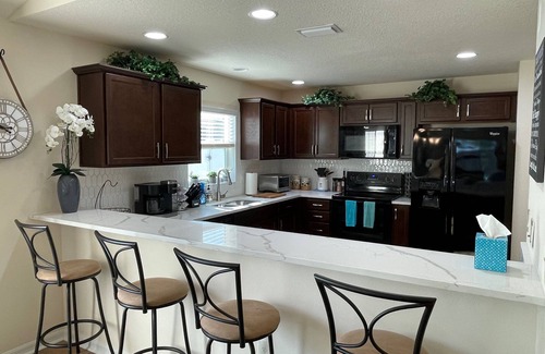 Summerfield House | Stylish villa with golf cart, BBQ, near pool & shops in tranquil setting!