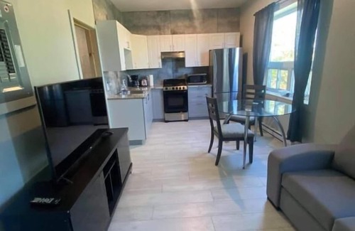 Rouyn-Noranda Apartment | Suite with closed bedroom (Le Convivial)