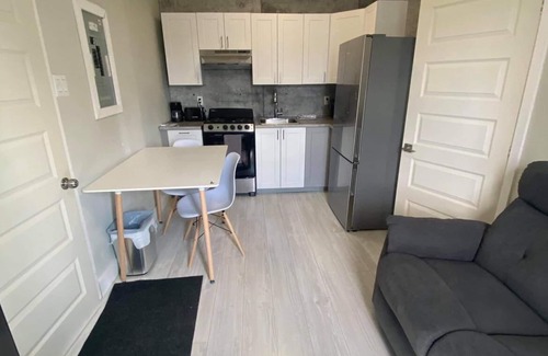 Rouyn-Noranda Apartment | Suite with closed bedroom (Le Convivial)
