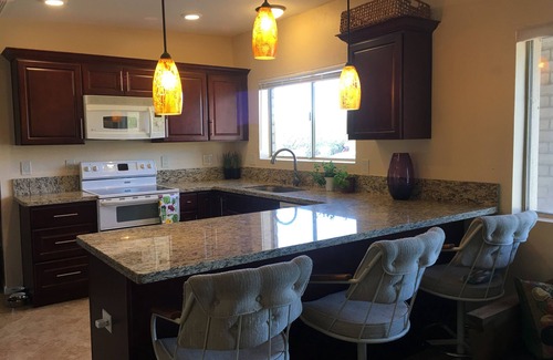 Tres Lomas North House | Sun-kissed foothills home with stunning mountain views and heated pool.
