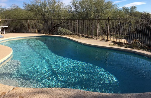 Tres Lomas North House | Sun-kissed foothills home with stunning mountain views and heated pool.