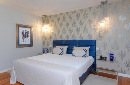 Sandim House | Sundial Gardens & Suites