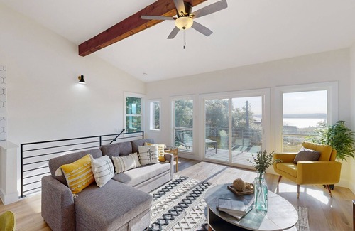 Comanche Trail Condo | Sunlit condo with water view, furnished balcony, washer/dryer, & central AC