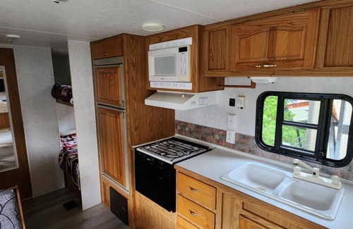 Garden House | "Sunrise Beach" Travel Trailer on 435' of Lake Michigan frontage- Fish on!