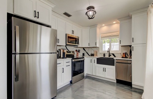 Indian Rocks Beach House | Sunrise Suite Waterfront Duplex- hot tub, kayaks, SUPs, 3 blocks to the beach