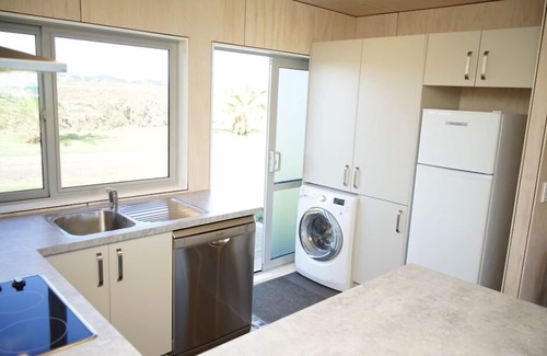 Warea House | Surf highway coast house. ocean front bach