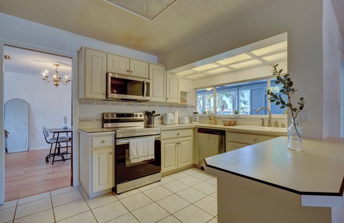 Cocoa Isles House | Surfer's Corner - Cozy Waterfront Oasis w/Fire Pit - Walk to Beach