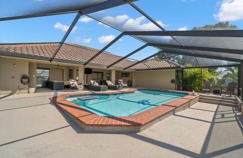 Apollo Beach House | Surfside Beach House - Gorgeous Canal Front Home - Heated Pool & Boat Dock
