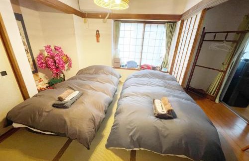 Edogawa House | Tatami room & Living Room equipped with Multinational TV and Fire, BBQ corner in Tokyo Downtown House