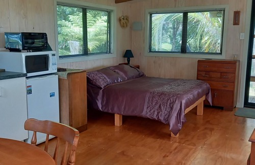 Russell House | Te Oneroa Hill, 5 acres of native park with wonderful sea view.