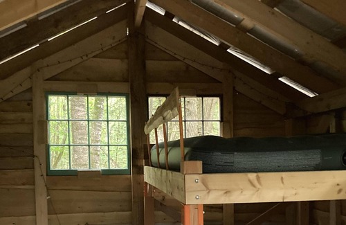Freedom RV Rental | Tentrr Signature Site - Ohana Roots Camp at Sandy Pond, Forest Hideaway Site
