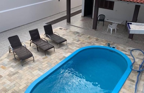Guaratuba House | Terraced house with pool near the sea