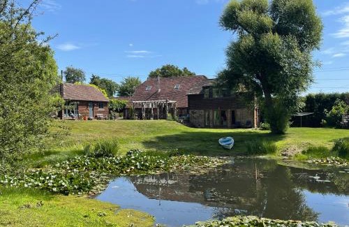 Ringmer Apartment | The Barn cottage with hot tub overlooking the lake