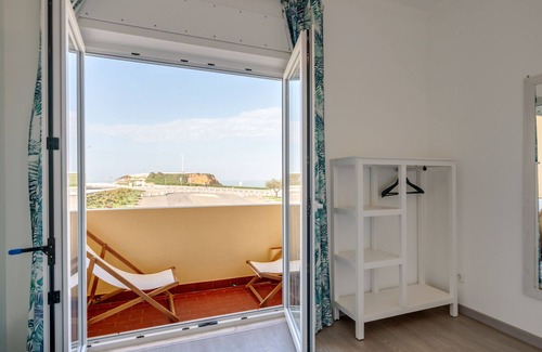 Praia de Santa Cruz House | The beach and the village center 1 minute walk from the house! ideal for small families