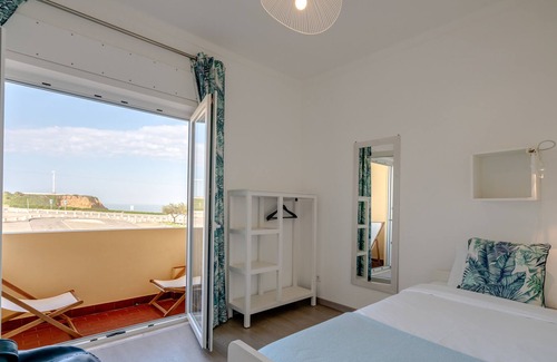 Praia de Santa Cruz House | The beach and the village center 1 minute walk from the house! ideal for small families