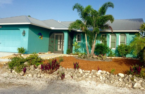 Matlacha Isles House | The Blue Lagoon With Heated Pool/on the Canal With NEW Boat Lift and Dock