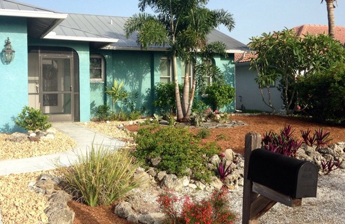 Matlacha Isles House | The Blue Lagoon With Heated Pool/on the Canal With NEW Boat Lift and Dock
